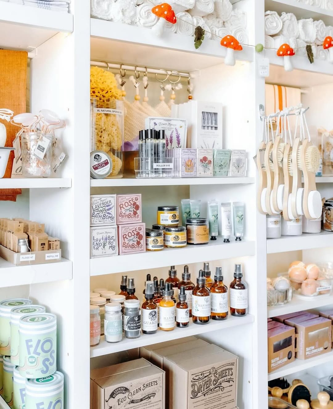 Image of Springfield Mercantile Co. interior showing Bath &amp; Body goods on white shelving on the about page. 
Keywords: Springfield Mercantile Co., About Us, Peek Into Our Shop, Bath &amp; Body, bath &amp; body goods on white shelves image, online shop, Shopify

