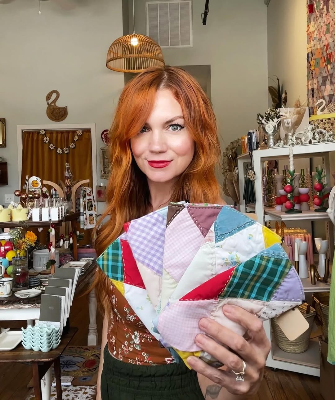 Image of Springfield Mercantile Co. owner Katie Shelton holding handmade eyeglass cases made from an antique quilt on the about page. 
Keywords: Springfield Mercantile Co., About Us, Peek Into Our Shop, owner Katie Shelton holding handmade quilt eyeglass cases image, online shop, Shopify

