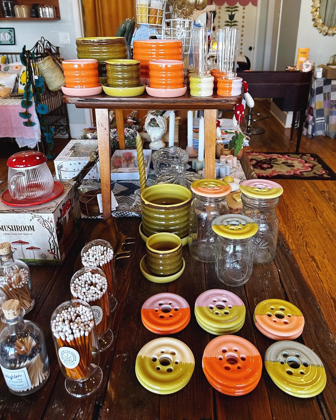 Image of Springfield Mercantile Co. interior showing colorful ceramic home decor goods on rustic shelving on the about page. 
Keywords: Springfield Mercantile Co., About Us, Peek Into Our Shop, Home Decor, ceramic home decor goods on rustic shelves image, online shop, Shopify
