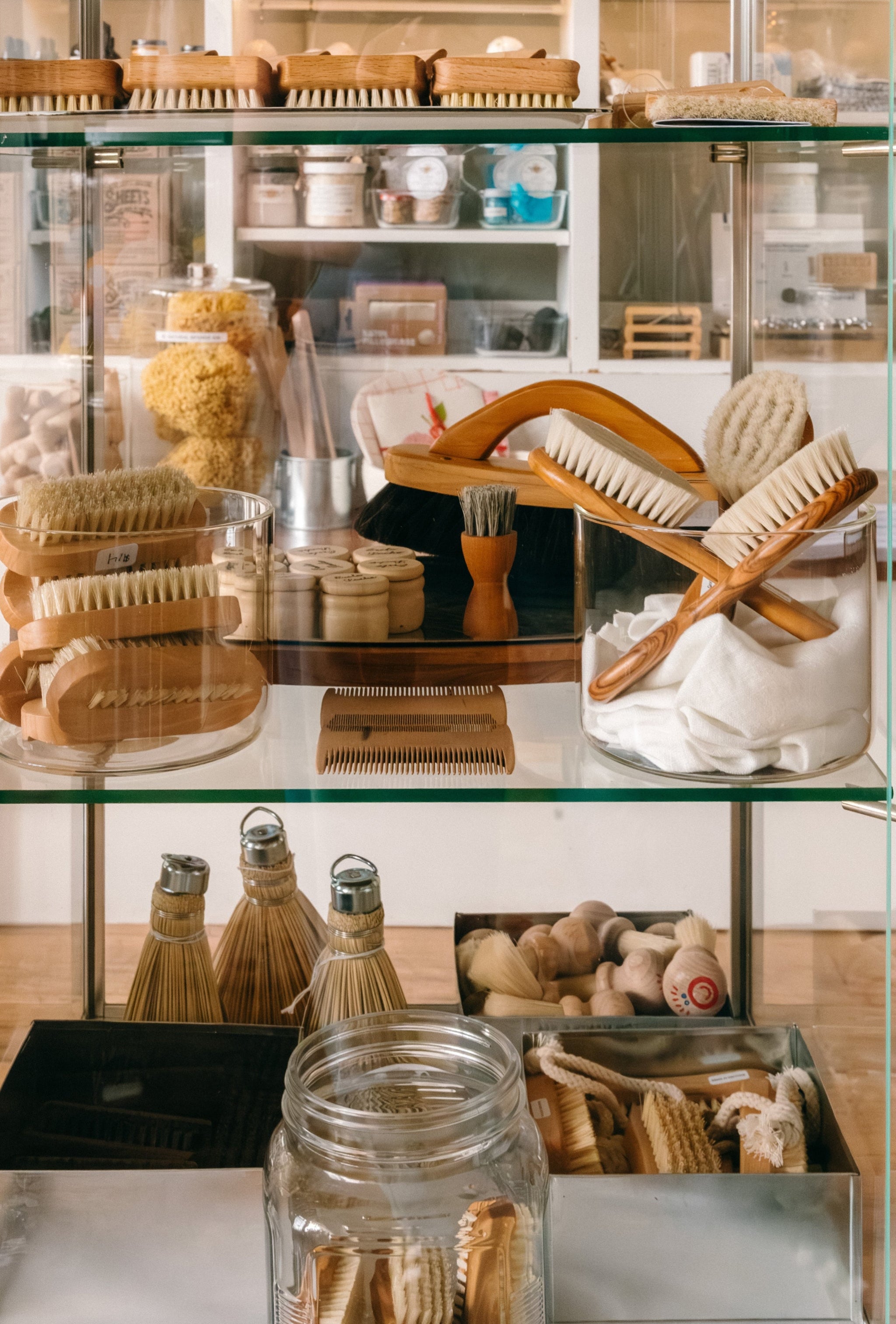 Glass display case with various natural bristle brushes, tools and cleaning products.

Description: Sliding image card promoting Brushes and Cleaning goods on the Springfield Mercantile Co. homepage. 
Keywords: Springfield Mercantile Co., classic brushes and cleaning, sliding image card, online store, Shopify