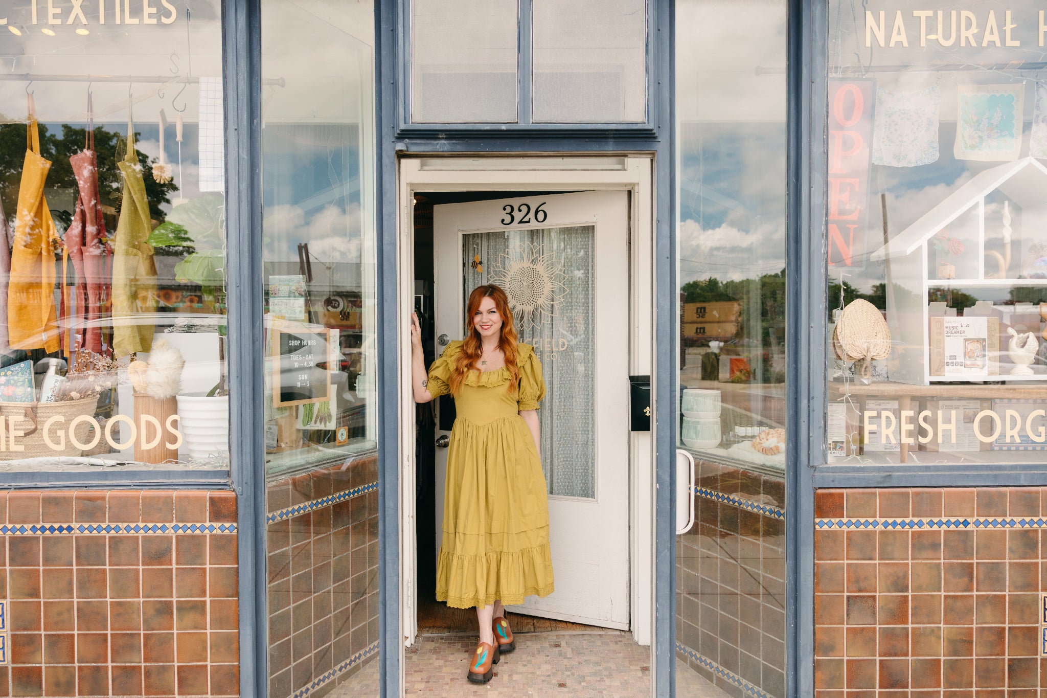 Banner image of Springfield Mercantile Co. building storefront with owner Katie Shelton inviting customers to reach out with questions on the Contact page. 

Keywords: Springfield Mercantile Co., Contact Us, Historic Commercial St, building storefront with owner Katie Shelton in the doorway image, online shop, Shopify
